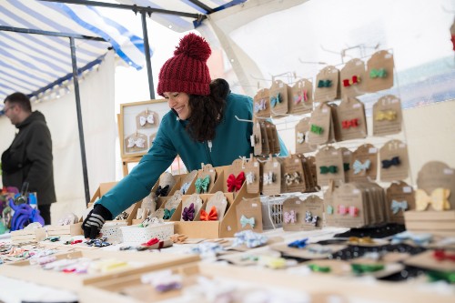A person behind a market stall