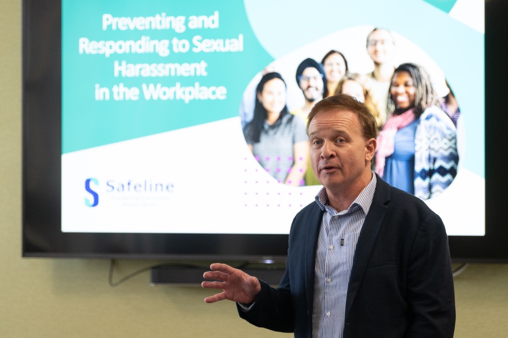 Person stood at the front of a wellbeing event