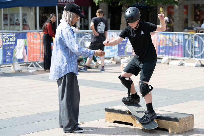 Young person grinding on a skateboard